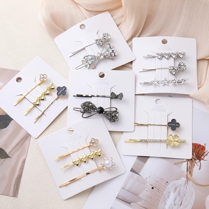 Elegant butterfly and pearl hair clip set with sparkling rhinestones in gold finish