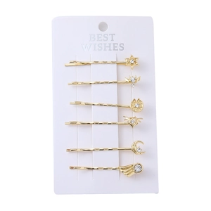 Golden punk rhinestone hair clip set with star and moon designs on display card