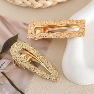 Elegant gold alloy hair clip set with textured crushed gold finish in geometric shapes