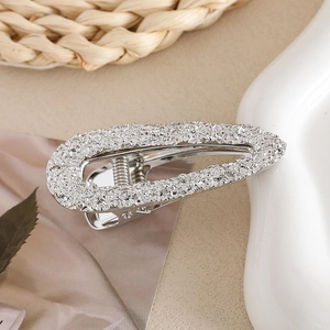 Polished silver alloy hair clip with hammer texture and oval cutout design