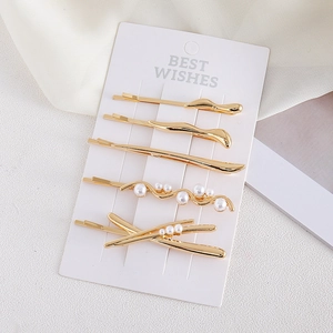 Lot de 5 barrettes dorées au design minimaliste en métal liquide et perles sur carte