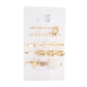 Set de 5 barrettes thème marin avec étoiles de mer dorées, coquillages et perles d'imitation