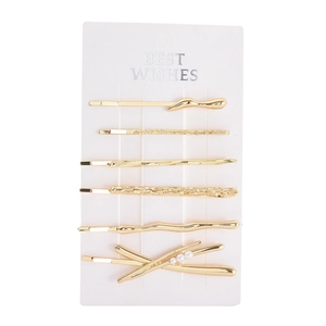 Lot de six barrettes dorées avec perles et textures sur carte de présentation