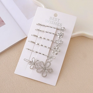 Lot de 6 barrettes à cheveux fleurs argentées avec strass brillants sur carte