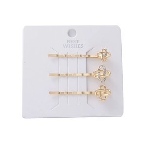 Set di tre fermagli dorati con nodi eleganti e dettagli in strass scintillanti