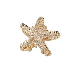 Elegant gold starfish metal hair clip with detailed texture for women's ocean hairstyle