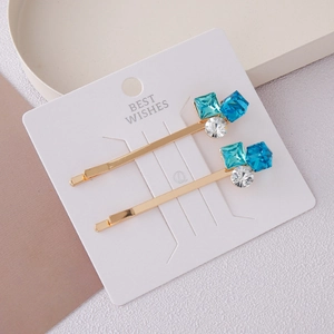Elegant gold alloy hair clips with blue square and clear round rhinestones on display card