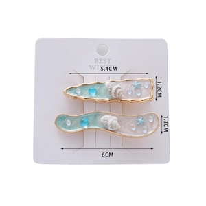 Détail des barrettes marines coquillage et étoile de mer avec dimensions affichées