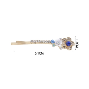 Barrette dorée élégante avec cristal bleu, fleur blanche et strass brillants 6.1cm