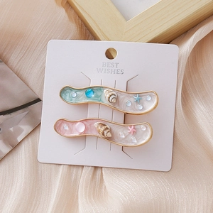 Lot de barrettes série océan avec coquillage et étoile de mer en émail menthe et rose