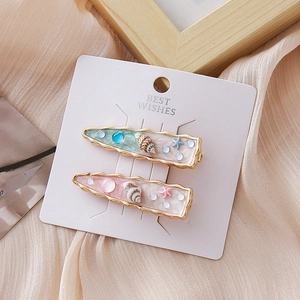 Lot de barrettes océan avec étoile de mer, coquillage et perles colorées scintillantes