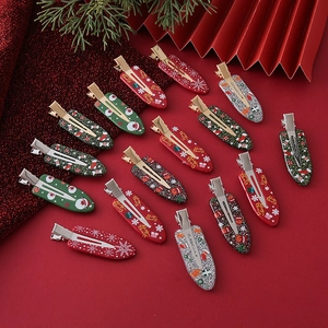 Detailed close-up of 14 festive Christmas hair clips featuring Santa Claus and reindeer patterns