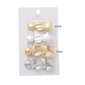 Star design metal hair clip set in gold and silver finish with geometric textures