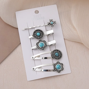 Detail of 5-piece silver alloy hair clips with bohemian turquoise stones and ethnic patterns