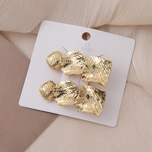 Golden geometric star hair clips set with square and round textured metallic design