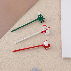 Detailset von Weihnachts-Haarspangen mit grünem Baum, Schneemann und Weihnachtsmann