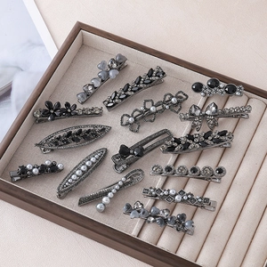 Elegant 14-piece black and silver floral hair clip set with pearls and rhinestones