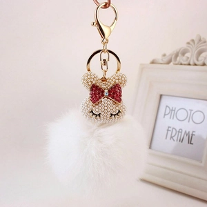 Porte-clés lapin en peluche blanc avec tête en perles et fermoir mousqueton doré