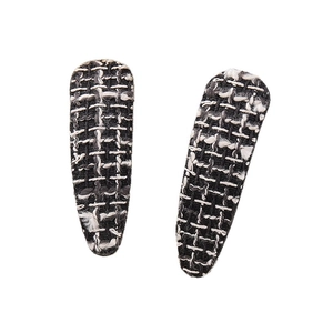 Pair of elegant houndstooth tweed BB hair clips in classic black and white for women