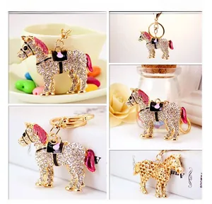 Detail of horse keychain with sparkling crystals and colorful enamel accents
