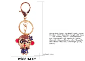 Detail view of monkey keychain with blue floral dress, dimensions 11.3cm and lobster clasp