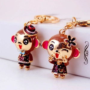 Charming metal monkey couple keychains with colorful enamel and rhinestone accents