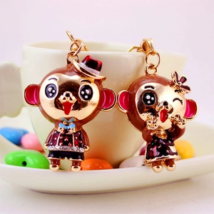 Charming couple monkey metal keychains featuring golden finish and colorful enamel glaze