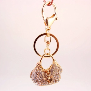 Sparkling rhinestone handbag keychain with heart pendant in 18K gold plated finish