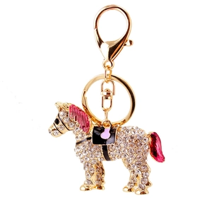 Golden horse keychain with white rhinestones and pink enamel accents for bag charm