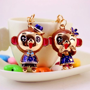 Cute couple monkey keychains with colorful enamel finish and golden metal clips