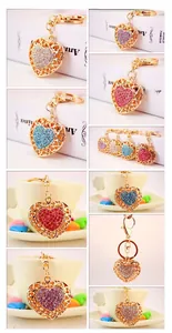 Detailed views of gold heart keychains with colorful rhinestones on white display