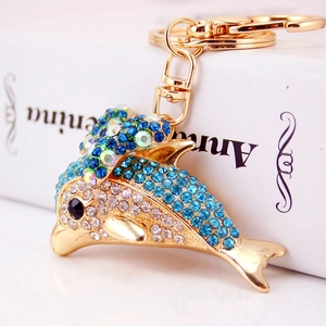 Sparkling blue rhinestone dolphin keychain with gold metal plating and starfish charm