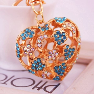 Porte-clés cœur doré évidé avec strass bleus et motifs étoile et lune créatifs