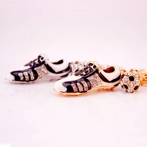 Diamond football shoe keychain set in black-white and gold-white finishes