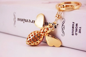 Detailed macro shot of the golden rhinestone honey bee keychain with sparkling crystals