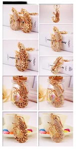 Detailed views of gold-plated lobster keychains featuring intricate crystal rhinestones