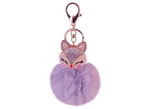 Detail of purple pompom fox keychain with pearl and rhinestone accents on rose gold clasp