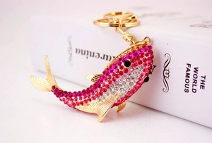 Detailed view of pink rhinestone koi fish keychain with golden ring and lobster clasp