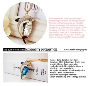 Detail view of crystal-encrusted dolphin necklace pendant with blue enamel and rhinestones