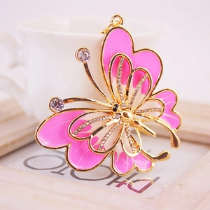 Pink enamel butterfly keychain with crystal rhinestones on a gold alloy metal frame