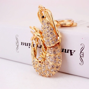Sparkling gold lobster keychain with white rhinestones and metal lobster clasp for bags