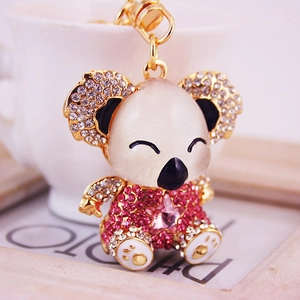 Sparkly rhinestone koala keychain in pink and white crystal with gold metal base