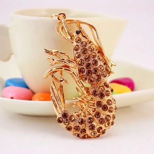 Sparkling lobster keychain with brown rhinestones and golden metal hardware pendant