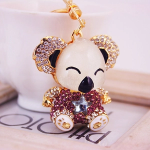 Sparkly koala keychain with purple rhinestones and blue star crystal pendant