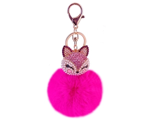Detail of rose gold fox keychain with pink rhinestone accents and fluffy faux fur ball