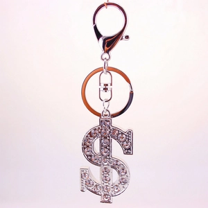 Glittering silver dollar sign keychain with inlaid rhinestones and lobster clasp