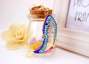 Detailed macro view of the ocean shark keychain with sparkling rhinestones and golden lobster clasp