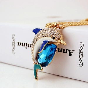 Golden dolphin pendant necklace with blue crystal and sparkling rhinestones on chain