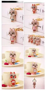 Multiple views of diamond-encrusted kitten keychains in various vibrant colors