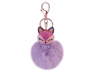 Detail view of fox head pendant with pink rhinestones and a lavender faux fur pompom